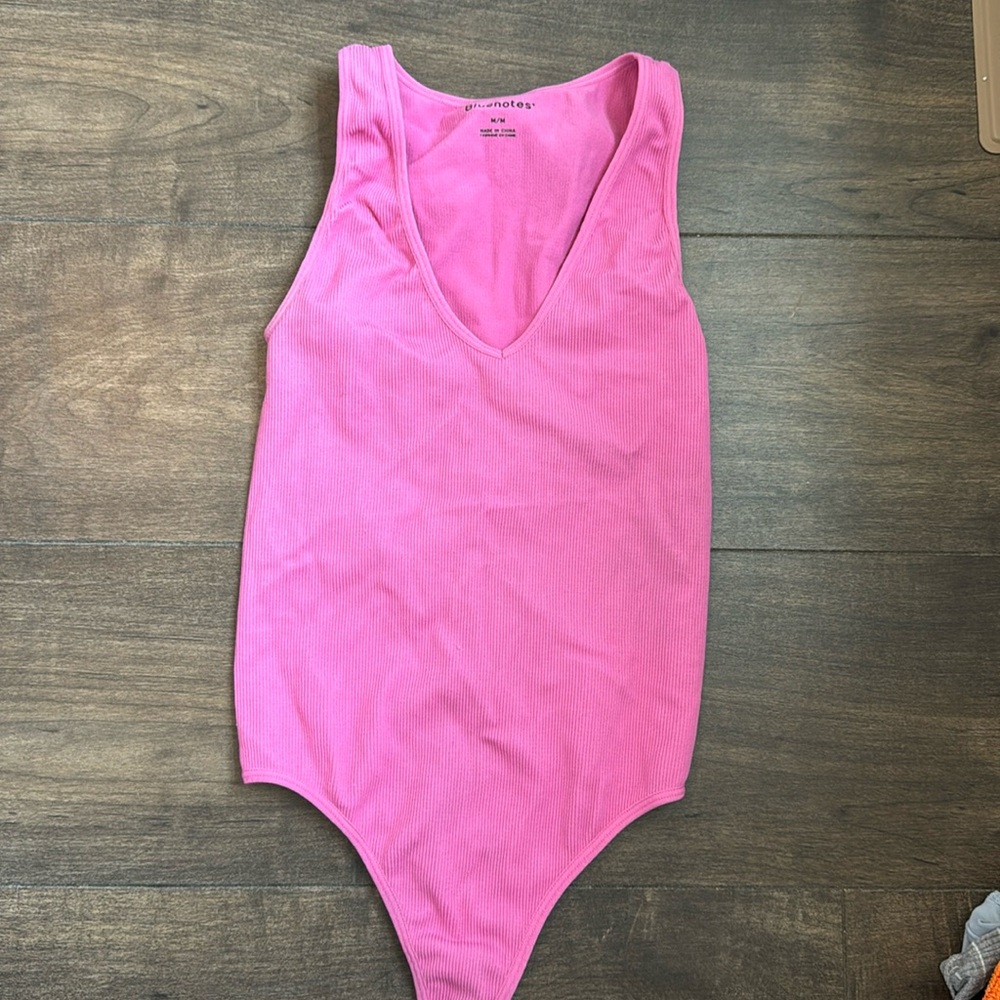 Pink ribbed body suit